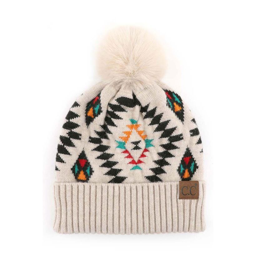 Beige C.C Soft Aztec Pattern Beanie with Faux Fur Pom,&nbsp;is beautifully knitted with a variety of colors and design that brings a unique look. Coordinate these aztec pattern beannie with any outfit to match the best with absolute warmth and coziness in style. This is an ideal winter head cover that comes in one size winter cap with a faux fur pom that fits most head sizes. Perfect winter gift accessory for your friends, family, and the persons you love.