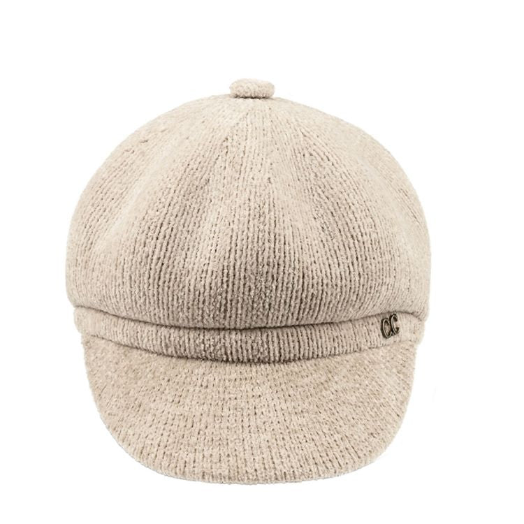 Beige C.C Solid Faux Leather Newsboy Cap features a sleek, solid design crafted from high-quality faux leather for a stylish, modern look. The classic newsboy silhouette provides a comfortable fit, making it perfect for everyday wear or dressy occasions.
