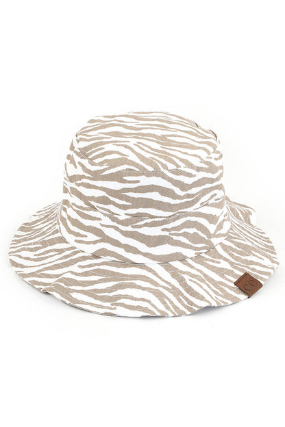 Beige C.C. ZEBRA PRINT BUCKET HAT is the perfect accessory for any outdoor adventure. Made from high-quality materials, it offers both style and functionality. Stay protected from the sun and make a statement with its bold zebra print design. Trust in C.C. for expertly crafted hats.