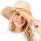 Beige Frayed Band and Trip Straw Sun Hat combines style and practicality. The frayed band adds a touch of texture, while the trip straw material provides superior sun protection. Perfect for a day at the beach or a stroll in the park, this hat will keep you both fashionable and protected.
