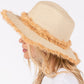 Beige Frayed Band and Trip Straw Sun Hat combines style and practicality. The frayed band adds a touch of texture, while the trip straw material provides superior sun protection. Perfect for a day at the beach or a stroll in the park, this hat will keep you both fashionable and protected.