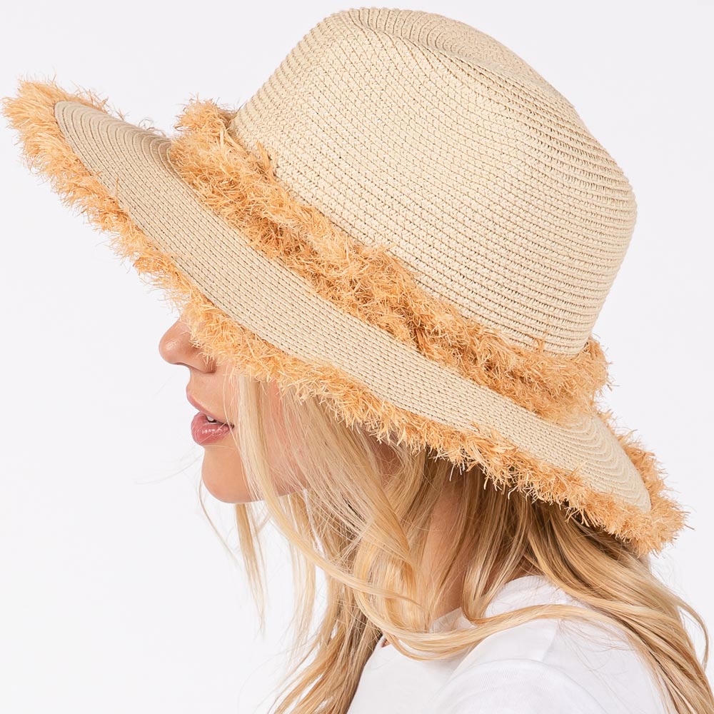 Beige Frayed Band and Trip Straw Sun Hat combines style and practicality. The frayed band adds a touch of texture, while the trip straw material provides superior sun protection. Perfect for a day at the beach or a stroll in the park, this hat will keep you both fashionable and protected.