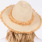 Beige Frayed Band and Trip Straw Sun Hat combines style and practicality. The frayed band adds a touch of texture, while the trip straw material provides superior sun protection. Perfect for a day at the beach or a stroll in the park, this hat will keep you both fashionable and protected.