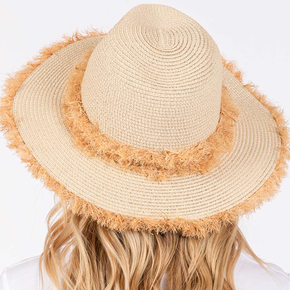 Beige Frayed Band and Trip Straw Sun Hat combines style and practicality. The frayed band adds a touch of texture, while the trip straw material provides superior sun protection. Perfect for a day at the beach or a stroll in the park, this hat will keep you both fashionable and protected.