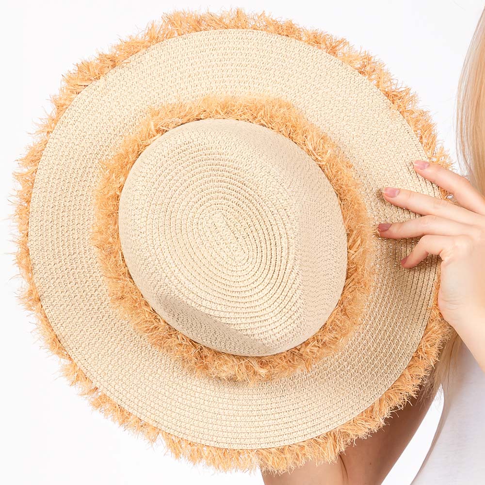 Beige Frayed Band and Trip Straw Sun Hat combines style and practicality. The frayed band adds a touch of texture, while the trip straw material provides superior sun protection. Perfect for a day at the beach or a stroll in the park, this hat will keep you both fashionable and protected.