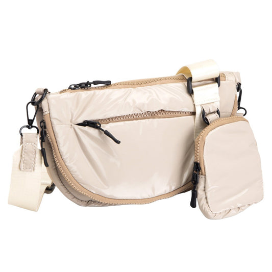 Beige Glossy Puffer Half Moon Crossbody Bag, the lightweight, stylish design features a durable water-resistant nylon that is perfect for outdoor activities. The adjustable shoulder strap makes it easy to sling across your body for hands-free convenience. Carry your essentials in style and comfort with this fashionable bag.