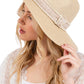 Beige Tweed with Pearl Band Summer Straw Sun Hat delivers exceptional structural resilience with optimal weight distribution. The pearl band features precisely calibrated pearl-to-space ratios that create visual rhythm while reinforcing the critical crown-brim transition. The brim architecture incorporates a multi-density weave that maintains dimensional stability in variable humidity while offering comprehensive UV protection with a calculated 8.5-degree downward angle. 