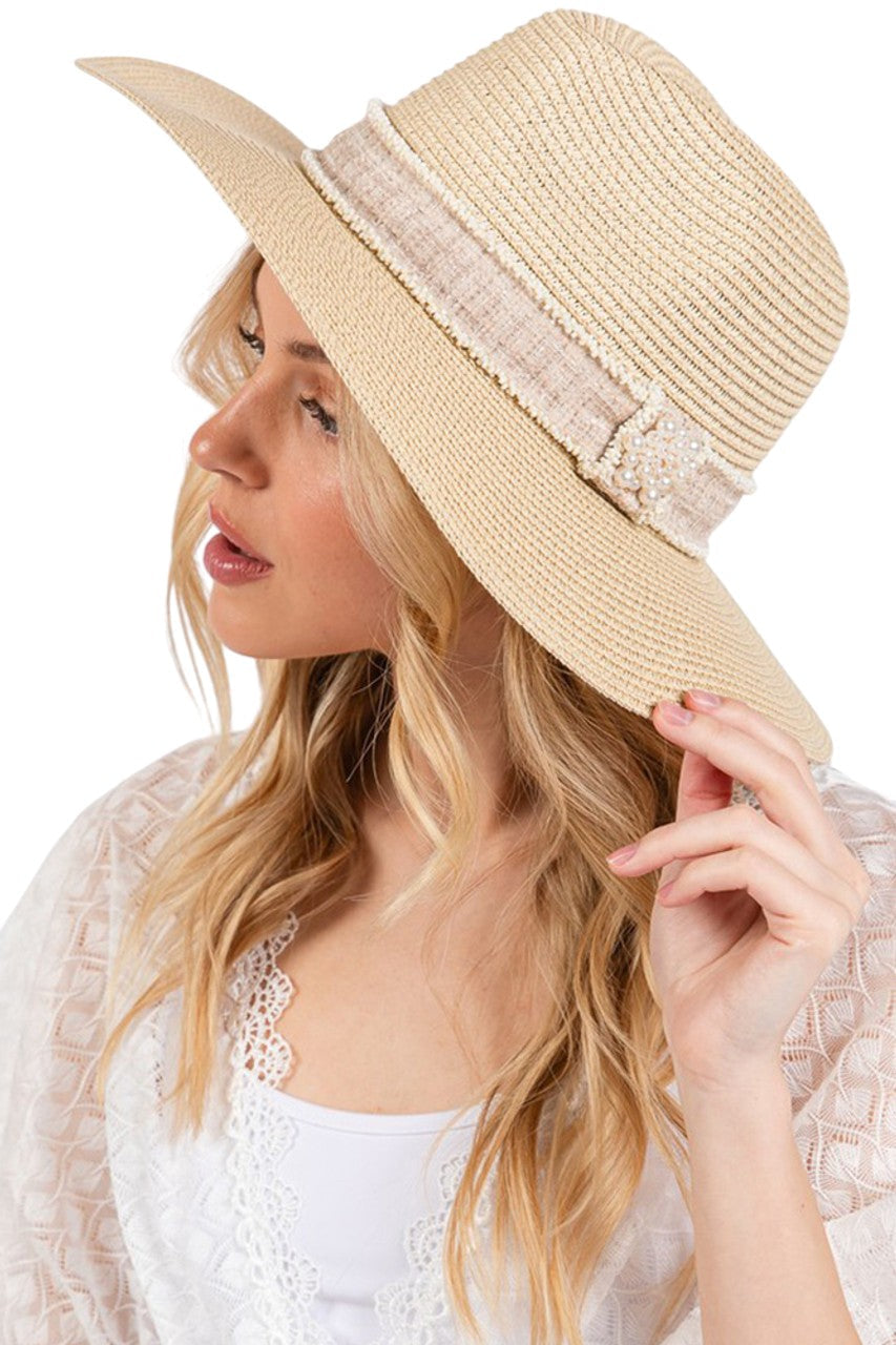 Beige Tweed with Pearl Band Summer Straw Sun Hat delivers exceptional structural resilience with optimal weight distribution. The pearl band features precisely calibrated pearl-to-space ratios that create visual rhythm while reinforcing the critical crown-brim transition. The brim architecture incorporates a multi-density weave that maintains dimensional stability in variable humidity while offering comprehensive UV protection with a calculated 8.5-degree downward angle. 