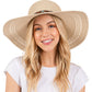 Beige Wide Brim Straw Sun Hat with Evil Eye and Multi Design Band offers stylish sun protection with its unique evil eye and multi-design band. Its wide brim provides ample shade while the evil eye brings a touch of charm. Stay safe from the sun while adding a fashionable touch to your outfit. 