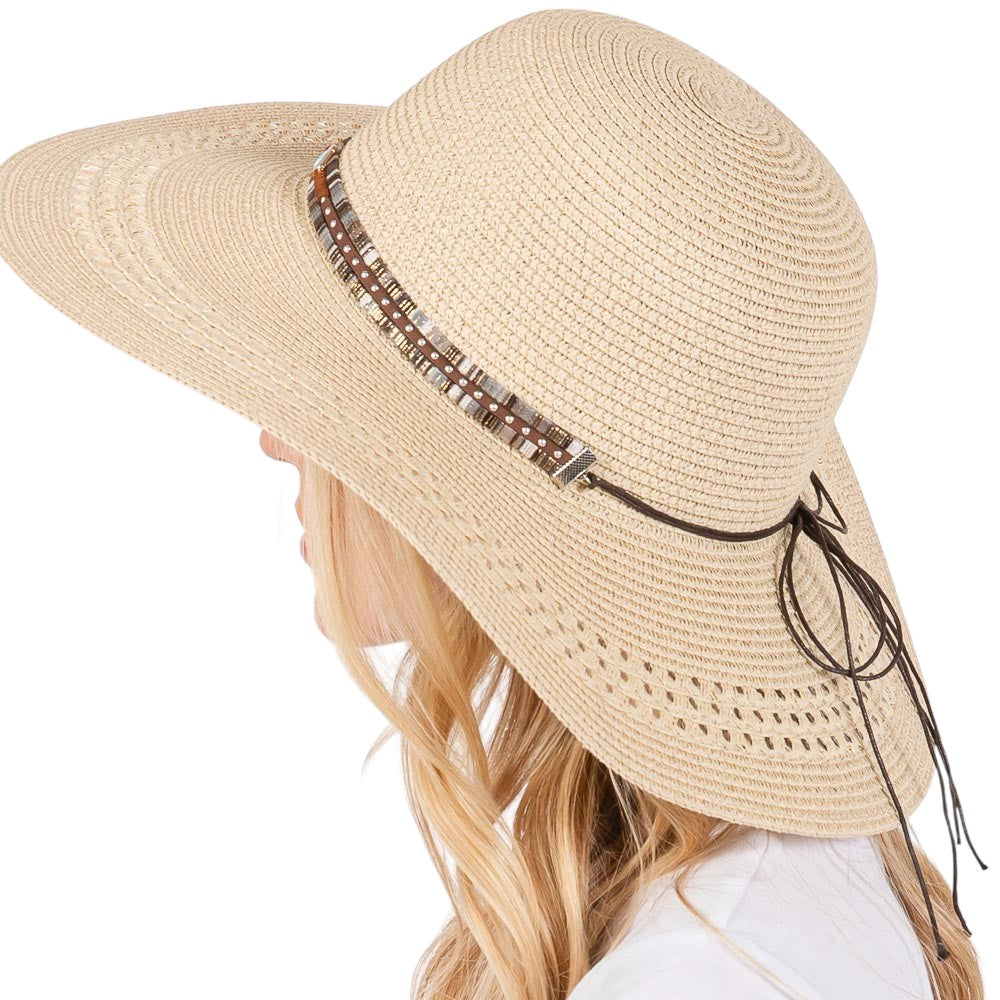 Beige Wide Brim Straw Sun Hat with Evil Eye and Multi Design Band offers stylish sun protection with its unique evil eye and multi-design band. Its wide brim provides ample shade while the evil eye brings a touch of charm. Stay safe from the sun while adding a fashionable touch to your outfit. 
