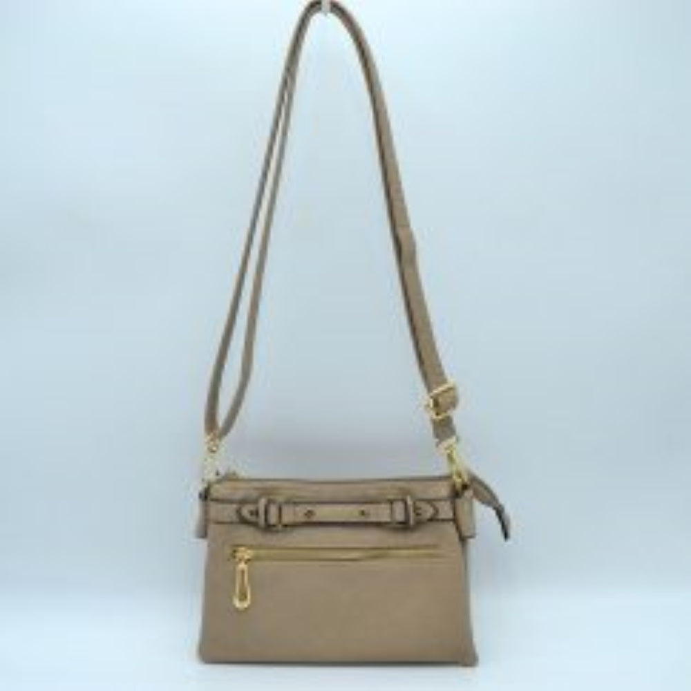 Beige This functional crossbody bag is designed for organized everyday use, featuring a textured exterior equipped with multiple secure storage compartments. The front panel includes a convenient horizontal zippered pocket accented with an oversized metallic zipper pull, situated beneath a decorative horizontal band detailed with metallic studs and loops.