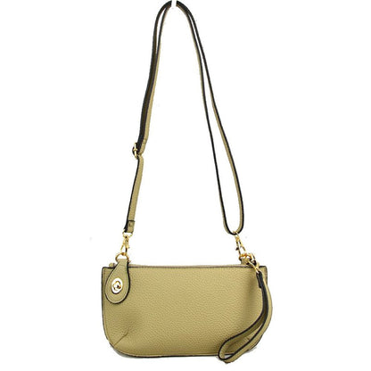 Beige This versatile everyday bag features a compact pebbled textured body with a slightly curved base silhouette. Designed for organized daily or evening use, the main storage compartment is secured by a top zipper closure and accented with a small decorative metallic turn-lock detail on the side panel. It offers multiple carrying options, equipped with a long, adjustable crossbody shoulder strap and a shorter matching wristlet loop