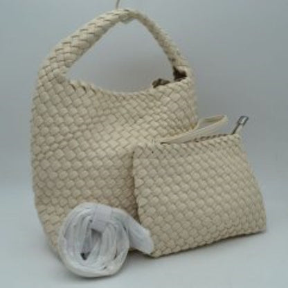 Beige This stylish everyday hobo bag features an all-over classic basket weave design and a slouchy silhouette. It is crafted with a seamless, integrated wide top handle that transitions directly into the main storage compartment for comfortable hand or shoulder carrying.
