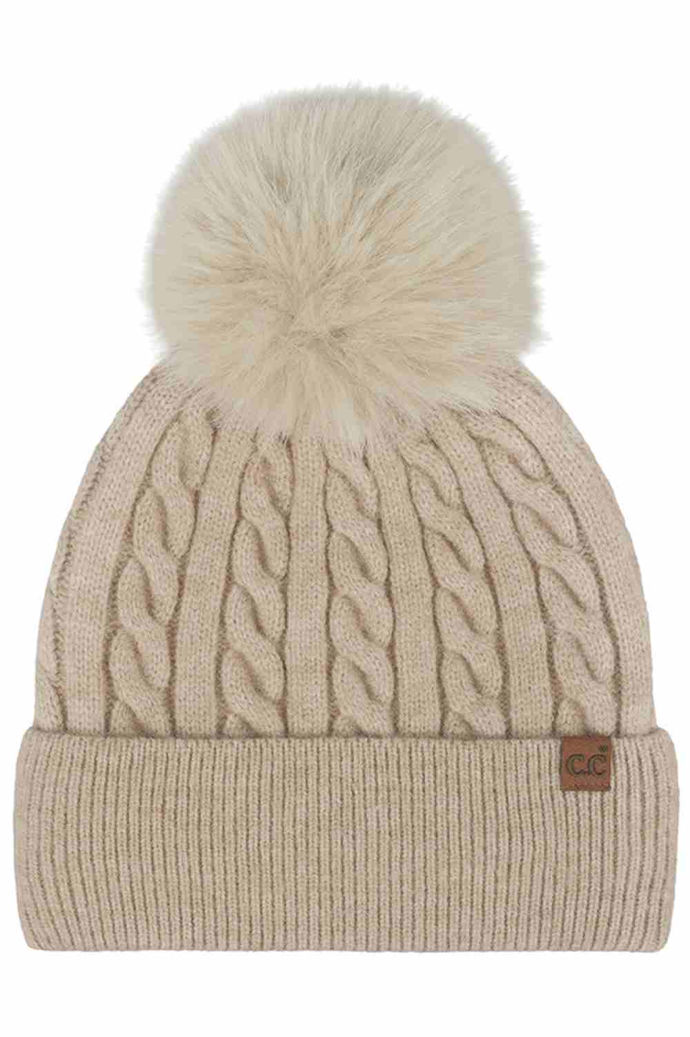 Beige C.C Cable Knit Pattern Pom and Cuff Beanie Hat features a classic cable-knit texture topped with a fluffy pom for a cozy, timeless winter look. Finished with a soft cuff and stretch fit, it keeps you warm and comfortable while adding effortless style to cold-weather outfits.