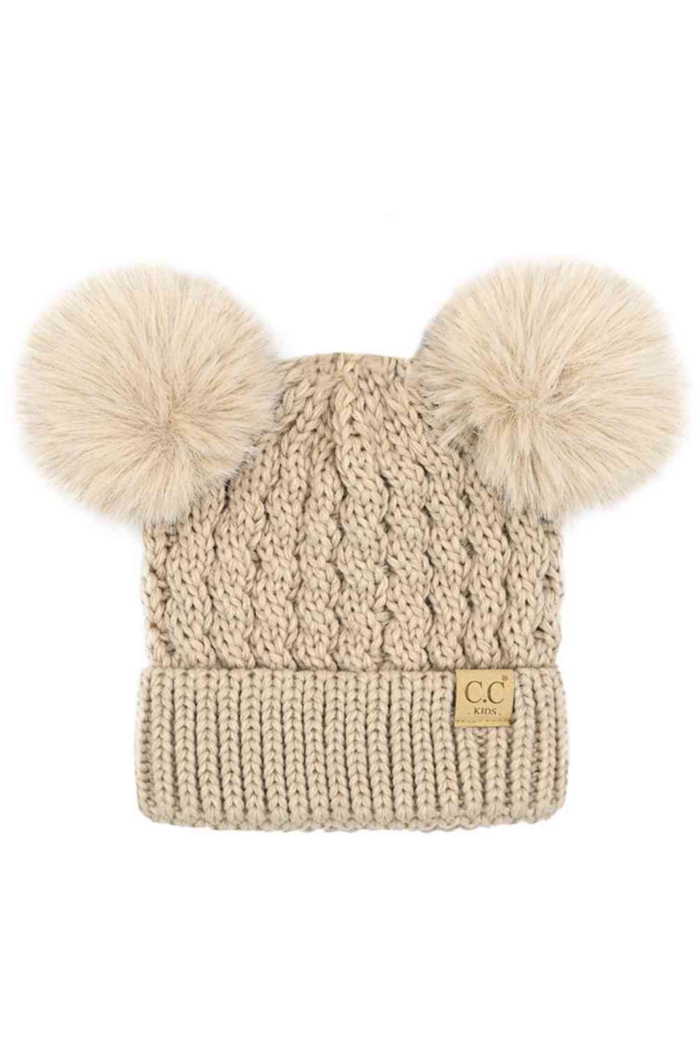 Beige Keep your child warm and stylish with this C.C Kids Double Pom Pom Beanie, featuring an all-over cable knit pattern. Made from 100% acrylic, it's soft, durable, and easy to care for. The playful double pom poms add a fun touch kids love.