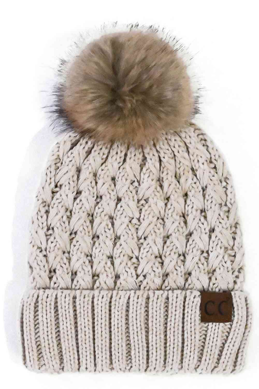 Beige Elevate your winter wardrobe with the C.C Lattice Crossover Stitch Beanie, featuring an intricate lattice pattern and cozy pom detail. Crafted from 100% soft acrylic, this beanie delivers warmth and comfort without the weight. The crossover stitch design adds visual interest while the relaxed fit suits most face shapes. Perfect for layering over your favorite winter looks, this versatile beanie transitions effortlessly from casual outings to outdoor adventures. One size fits most for easy, everyday we