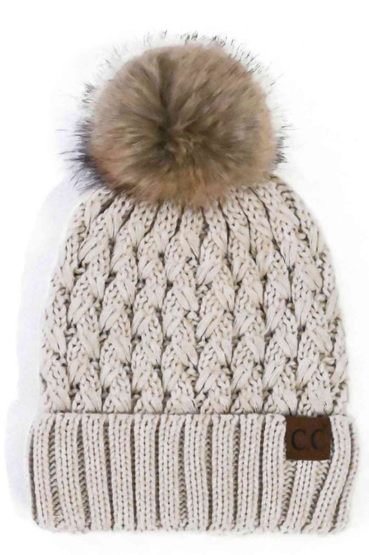 Beige Elevate your winter wardrobe with the C.C Lattice Crossover Stitch Beanie, featuring an intricate lattice pattern and cozy pom detail. Crafted from 100% soft acrylic, this beanie delivers warmth and comfort without the weight. The crossover stitch design adds visual interest while the relaxed fit suits most face shapes. Perfect for layering over your favorite winter looks, this versatile beanie transitions effortlessly from casual outings to outdoor adventures. One size fits most for easy, everyday we
