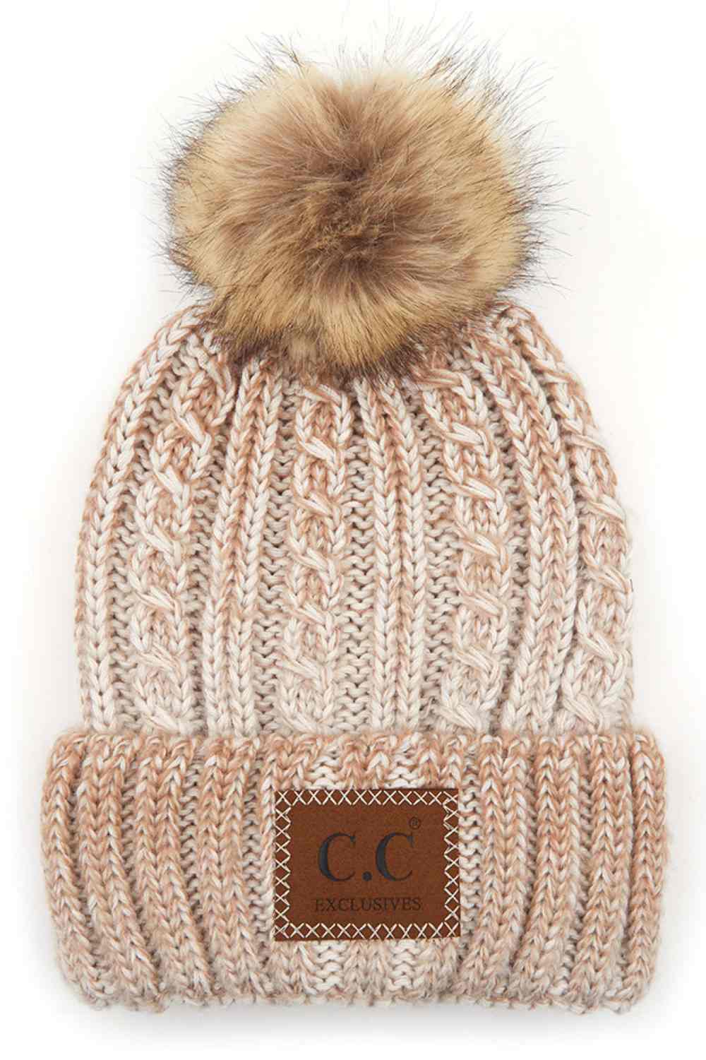 Beige Elevate your winter wardrobe with this C.C ombre beanie featuring a plush faux fur pom. Crafted from 100% acrylic, the soft knit construction provides warmth and comfort without bulk. Perfect for casual outings or layering under winter gear.