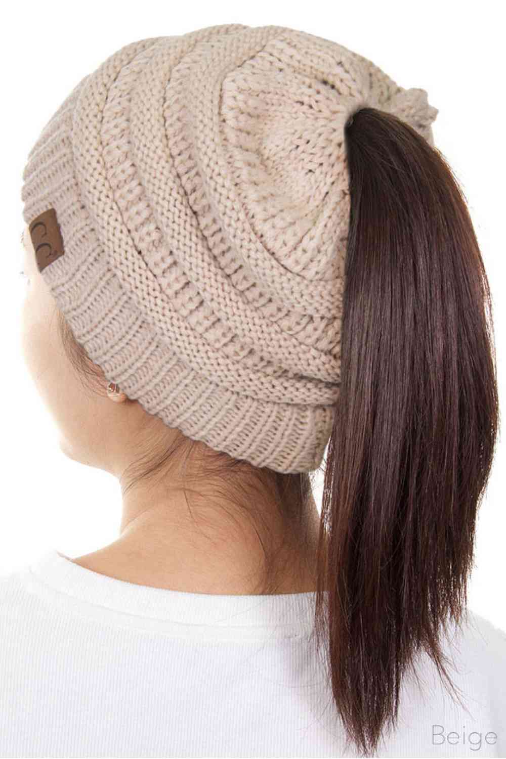 Beige The C.C Solid Color Ponytail Messy Bun Beanie combines comfort with versatility for effortless everyday style. Crafted from 100% soft acrylic, this beanie features an open crown design that accommodates ponytails and messy buns while keeping you warm. The one-size-fits-most construction ensures a secure, flattering fit for virtually anyone. Perfect for casual outings, workouts, or relaxed weekends, this practical accessory transitions seamlessly from season to season.