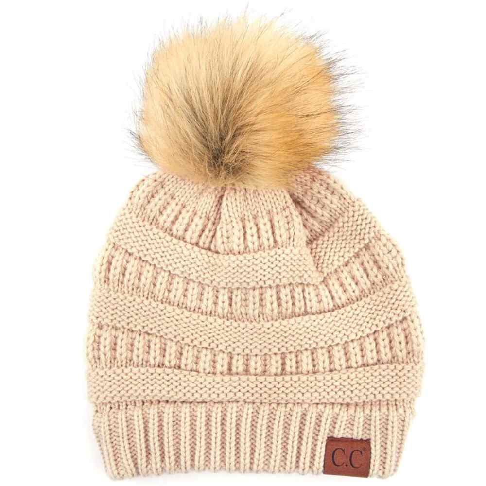 Beige Stay warm and cozy with this classic C.C Pom Pom Knit Beanie, crafted from 100% soft acrylic for all-day comfort. The ribbed knit design adds texture and durability, while the signature pom pom on top brings a playful touch to any winter outfit. One size fits most, making it the perfect accessory for everyone. Ideal for cold weather adventures or casual everyday wear.