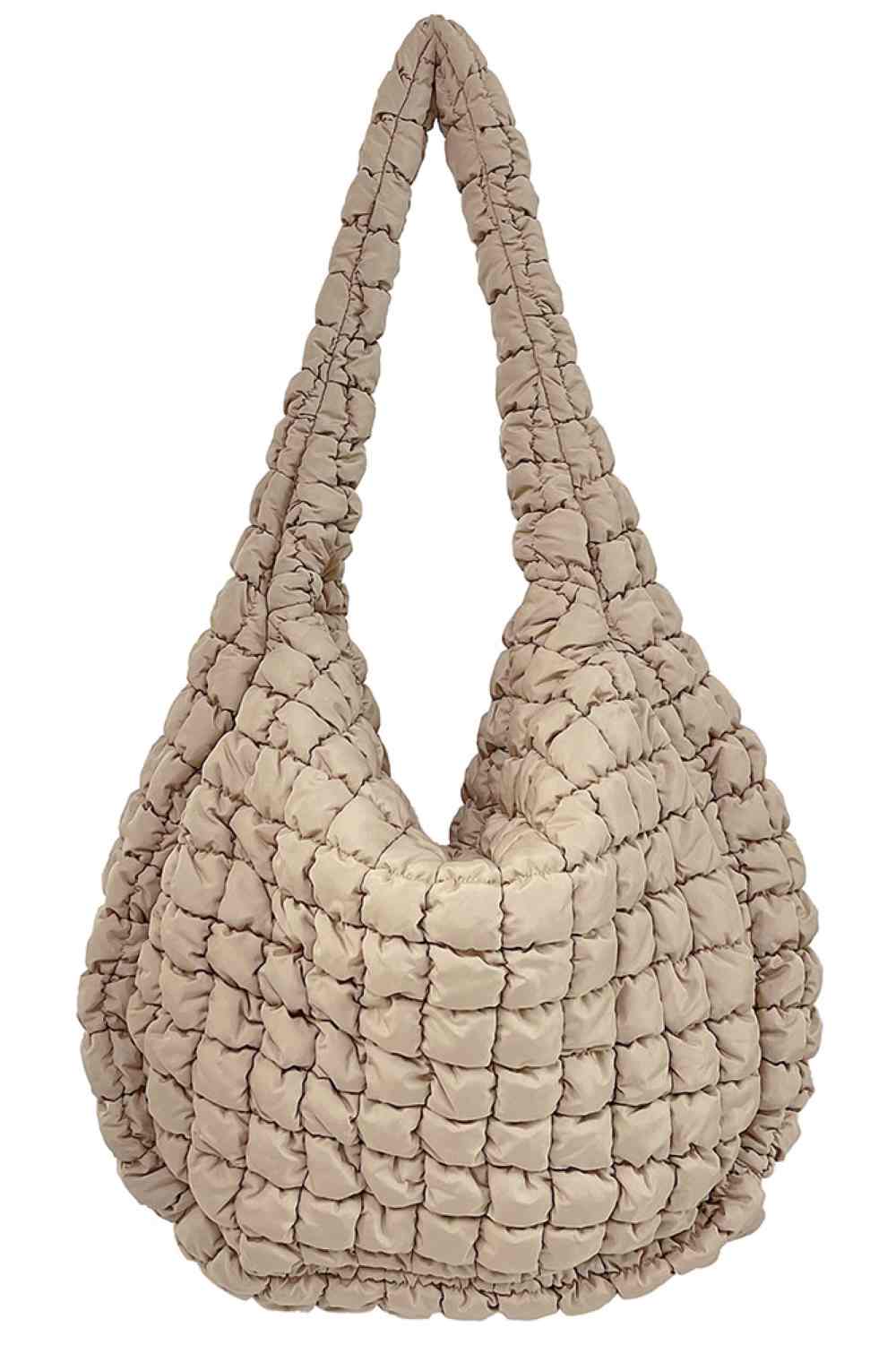 Beige Spacious quilted bag designed for everyday carry and travel. Features a durable 100% polyester construction with a quilted exterior for added protection and style. Generous dimensions of 17.7" x 19.7" x 8.7" provide ample room for essentials, making it perfect for shopping, work, or weekend getaways. Lightweight and easy to maintain. Made in China.