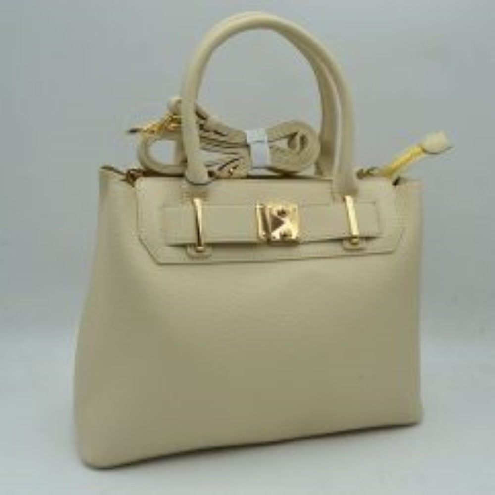Beige TThis structured satchel features a finely textured exterior finish with a clean silhouette, making it an excellent option for sophisticated everyday use. The front panel is detailed with a decorative horizontal belt accent threaded through metallic loops and secured by a square center turn-lock clasp. Equipped with dual rounded top handles for a traditional handheld carry