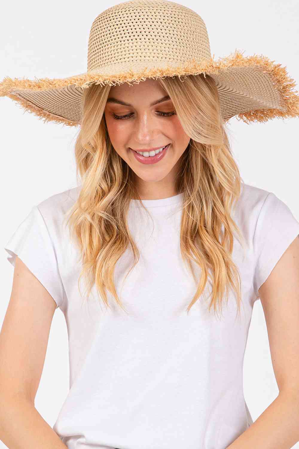 Beige Embrace effortless summer style with this frayed-edge two-tone floppy straw hat. Crafted from 100% paper, it offers a lightweight, breathable design perfect for sunny days. The wide brim provides excellent sun protection while the textured frayed edges add a relaxed, on-trend aesthetic.