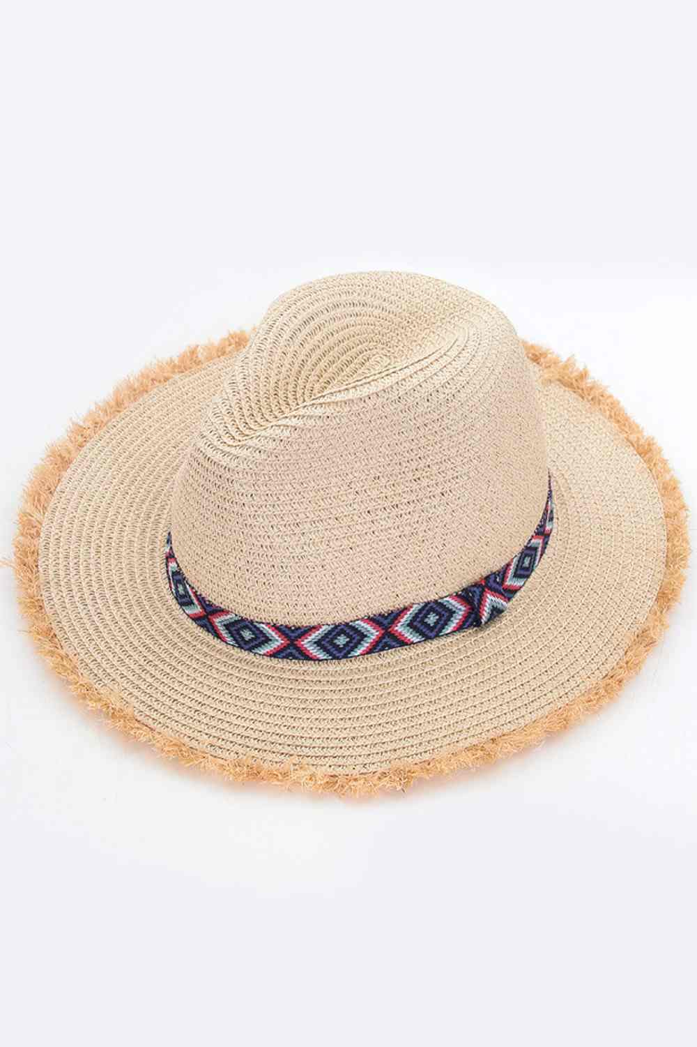 Beige Elevate your summer wardrobe with this Frayed Trim Aztec Straw Hat, a versatile accessory perfect for beach days and outdoor adventures. Crafted from 100% paper, this lightweight hat offers breathable comfort while the wide brim shields you from the sun's rays. Whether you're lounging poolside or exploring sun drenched destinations, this hat combines style and practicality for effortless seasonal appeal.