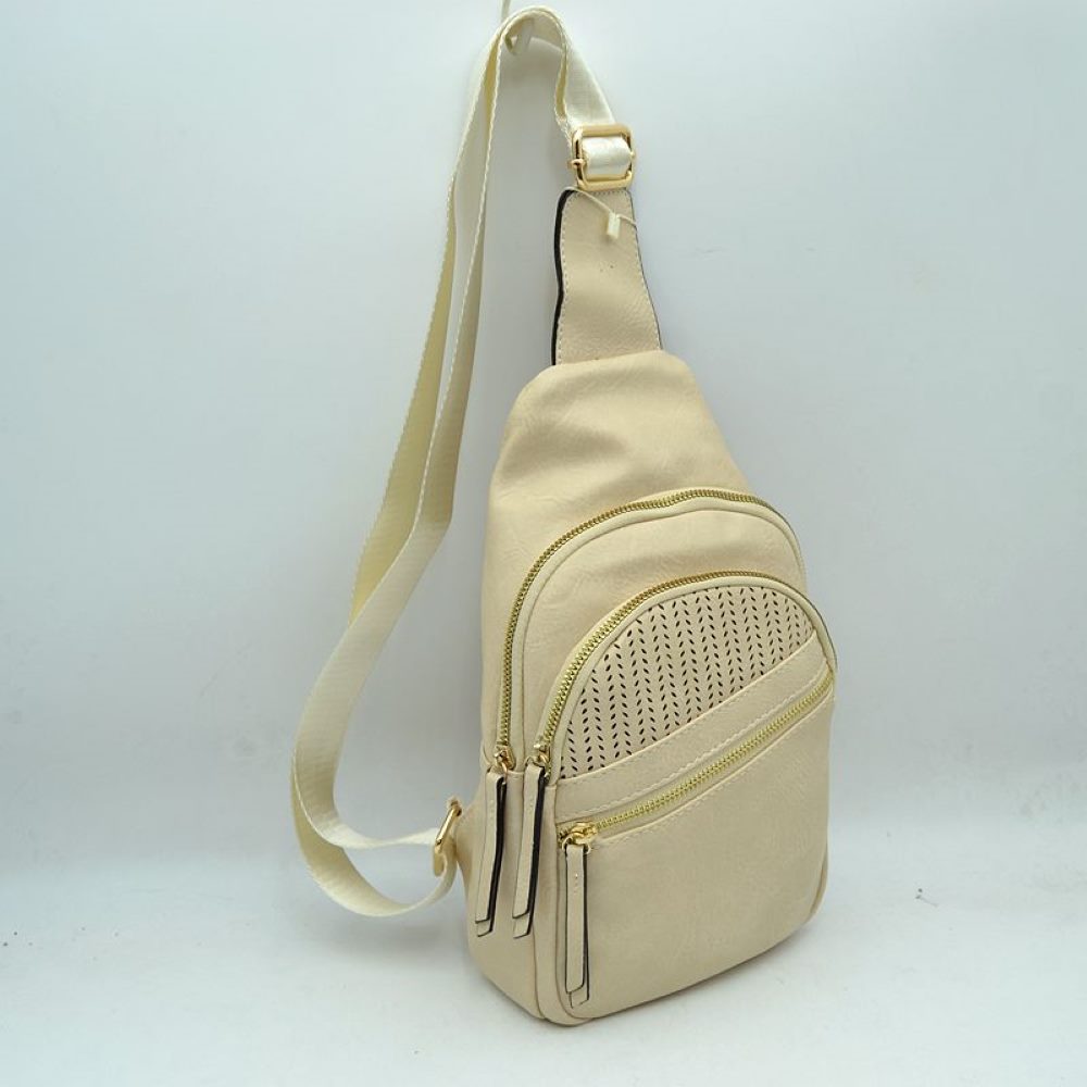 Beige This versatile sling bag features an asymmetric silhouette decorated with an arched, perforated pattern on the front panel, making it suitable for everyday use. It offers multiple organized storage compartments, including a main curved section, a mid-sized front zippered pouch, and a smaller diagonal zippered pocket near the base, all equipped with elongated pull tabs. Designed for convenience, the bag is completed with a single wide
