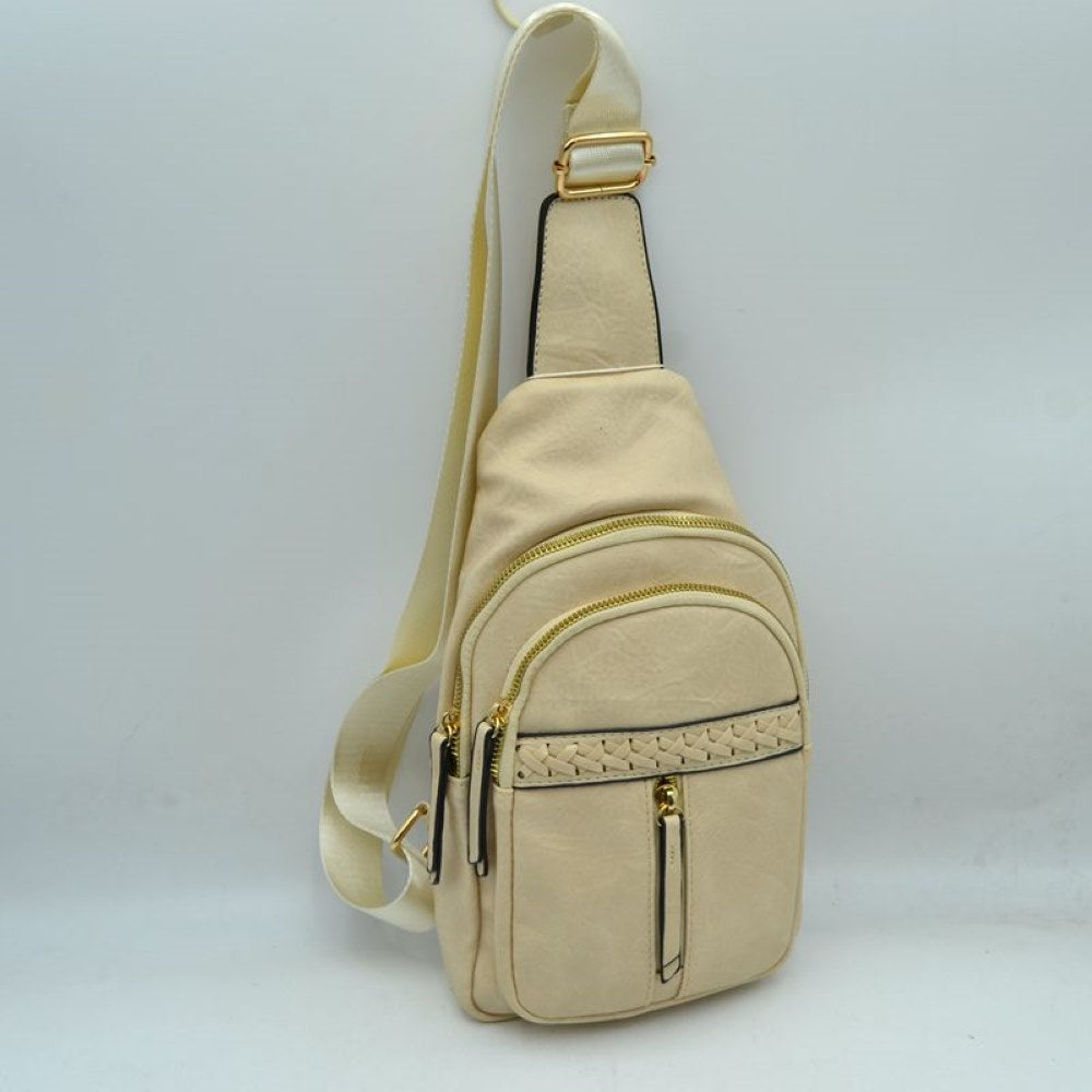 Beige This versatile sling bag features a textured, subtly crinkled exterior with an asymmetric, tiered silhouette ideal for active everyday use. It offers multiple organized storage compartments, including a spacious curved main section, an intermediate arched pouch, and a front pocket highlighted by a horizontal woven, braided strip detail above a vertical zipper track. The bag is completed by a single wide fabric shoulder strap