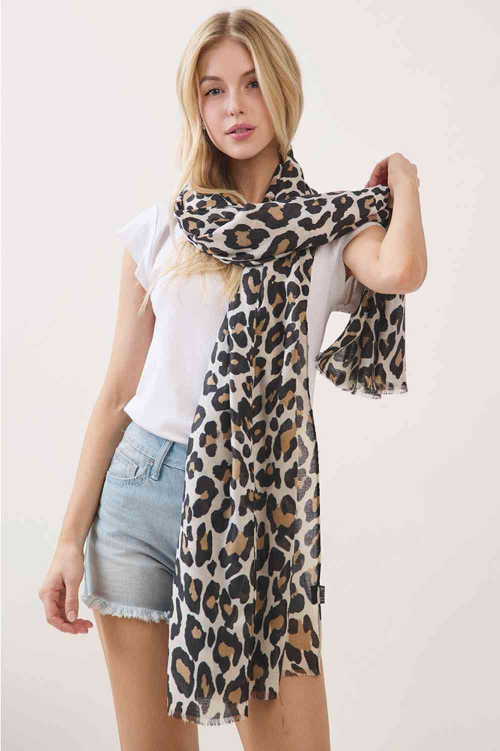 Beige Elevate your accessory game with this striking Leopard Pattern Print Oblong Scarf. Featuring a bold, timeless leopard print design, this versatile piece measures 35" x 70", making it perfect for draping, wrapping, or styling however you choose. Crafted from 100% polyester, it's lightweight, durable, and easy to care for. Whether you're layering for warmth or adding a pop of wild sophistication to your outfit, this scarf delivers effortless style. A must-have staple for any fashion-forward wardrobe.