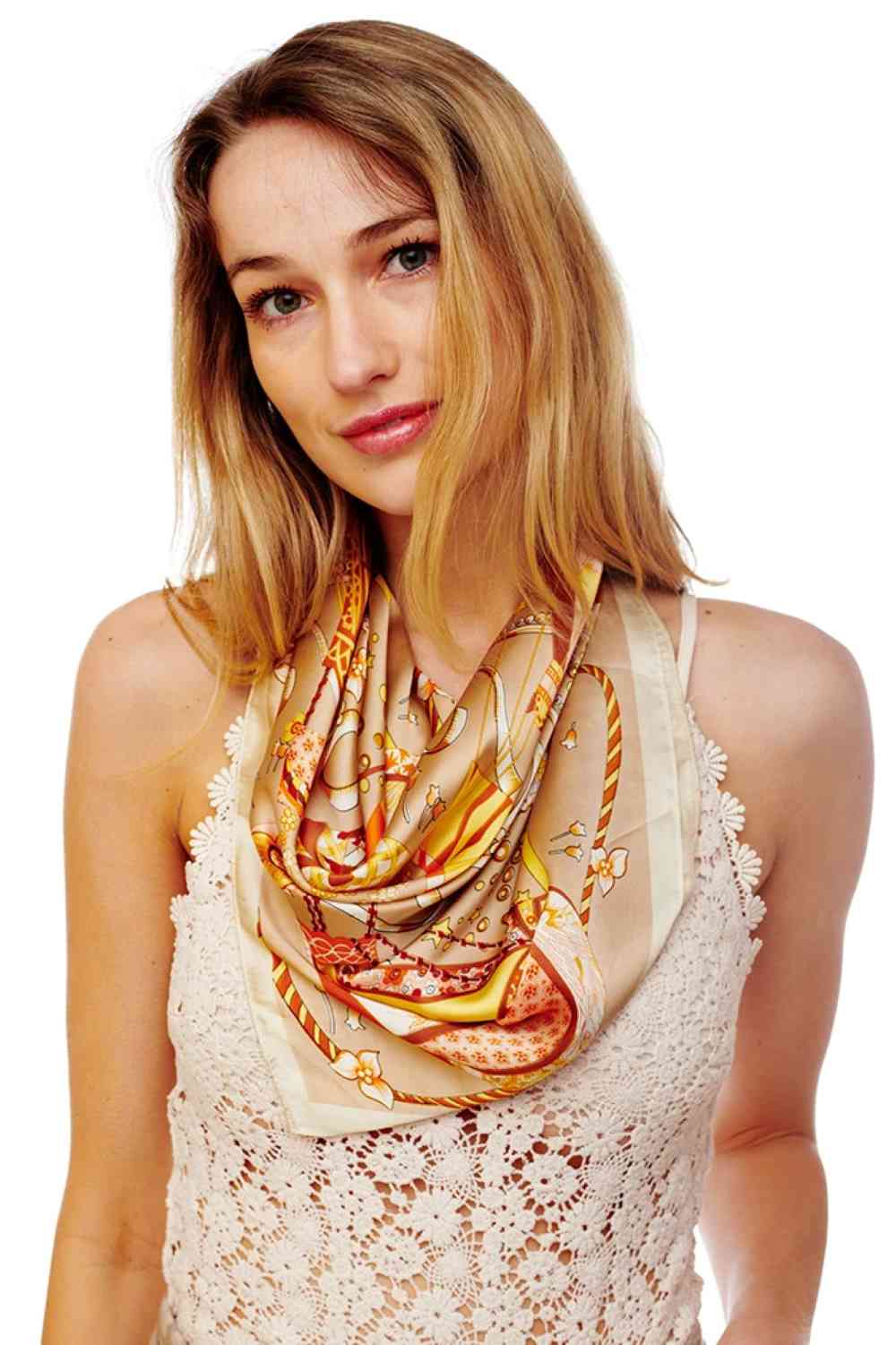Beige Elevate your accessory game with this versatile Multi Printed Silky Square Bandana. Crafted from 100% polyester, this luxuriously soft fabric drapes beautifully and resists wrinkles, making it perfect for any occasion. The generous 27.5" x 27.5" size offers endless styling possibilities wear it as a headscarf, neck wrap, hair accessory, or bag embellishment. The vibrant multi-color print adds a pop of personality to any outfit. 