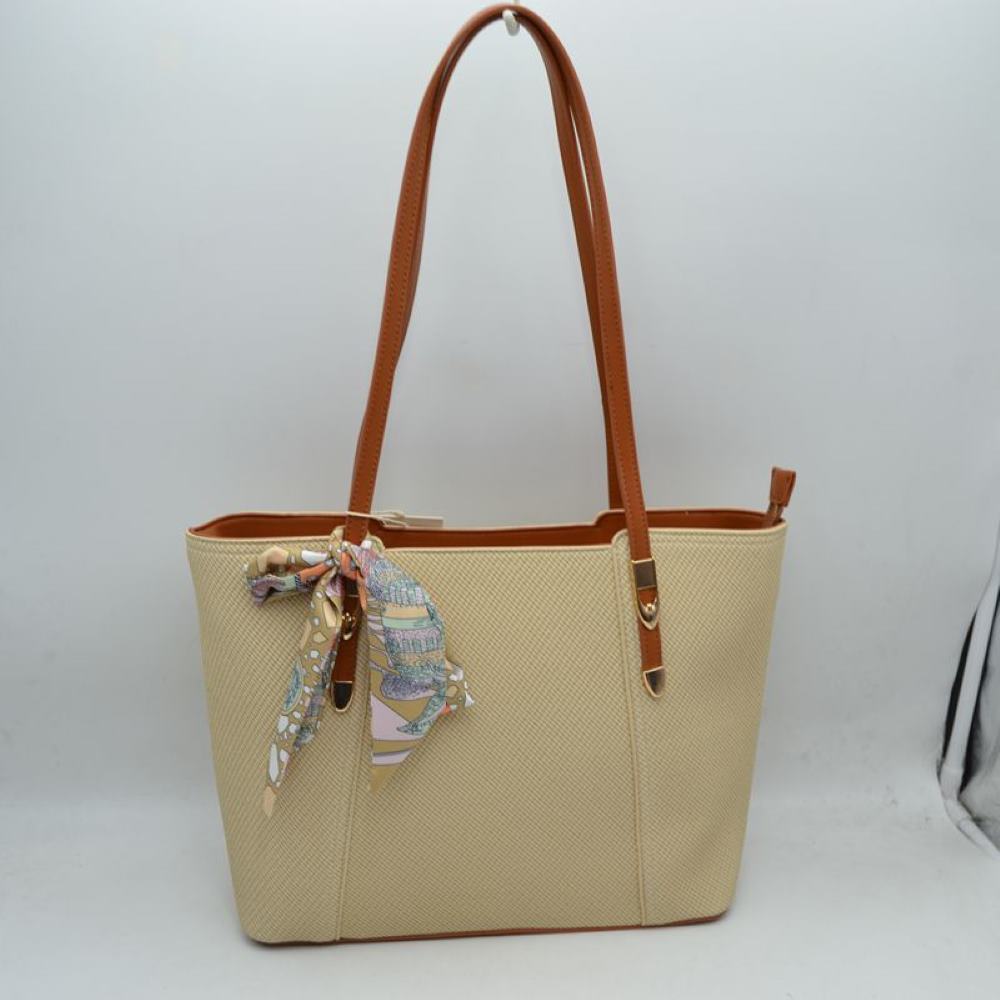 Beige Bring a touch of effortless resort-chic into your daily routine with this stunning cream and cognac shoulder tote. Designed with an elegant chevron-textured weave and beautifully contrasted by rich, warm tan accents, this bag is the ultimate fusion of classic sophistication and everyday practicality. Perfect for office styling, weekend getaways, or casual city strolls, it arrives detailed with a colorful, artistic silk-style scarf playfully tied to the handle for an immediate touch of luxury.