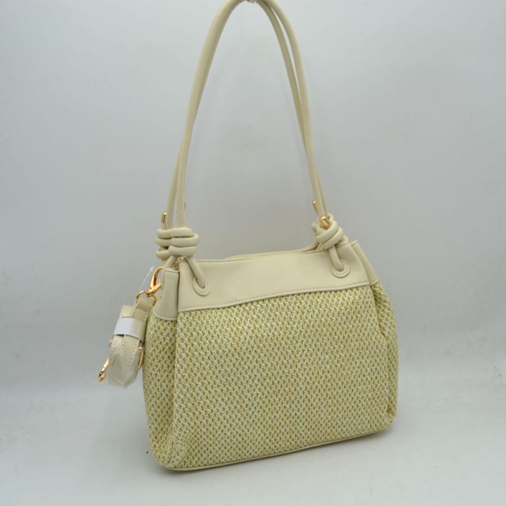 Beige Embrace a relaxed yet sophisticated aesthetic with this beautifully textured shoulder bag. The design prominently features a classic woven mesh panel across the main body, paired seamlessly with smooth trim along the upper edge and base. Dual slender shoulder straps attach to the bag with elegant, integrated knot details at the base, offering a comfortable drop for easy over-the-shoulder carrying. Adding to its versatile utility, a small, matching clip-on zippered pouch hangs from the side hardware
