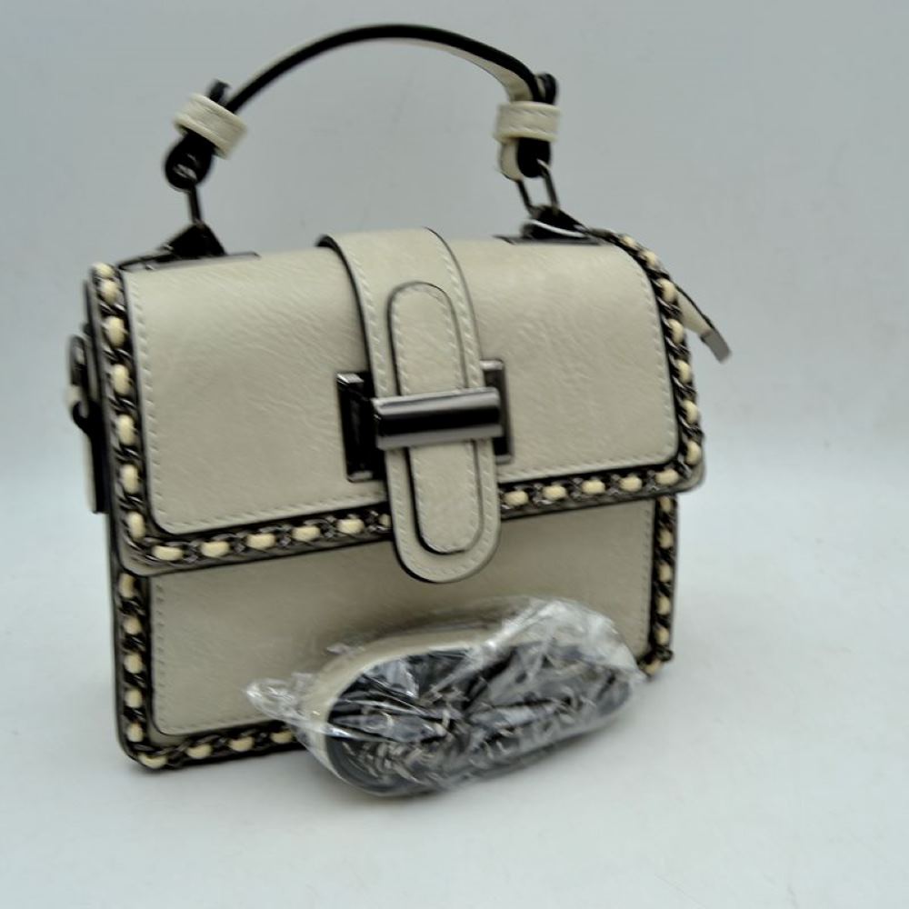 Beige Add a touch of structured elegance to your look with this chic top-handle satchel bag. Designed for the modern trendsetter, it seamlessly blends classic vintage vibes with contemporary edgy accents.