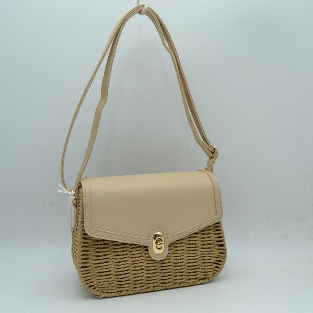 Beige Embrace warm-weather sophistication with this beautiful mixed-media shoulder bag. Effortlessly blending the rustic, organic charm of a woven straw basket body with a smooth, structured faux-leather flap enclosure, this bag is a must-have accessory for casual sunny days, resort vacations, or stylish weekend brunches. Its elegant silhouette offers a refined twist on classic beachwear aesthetics, transitioning perfectly from a day in the sun to an evening out.