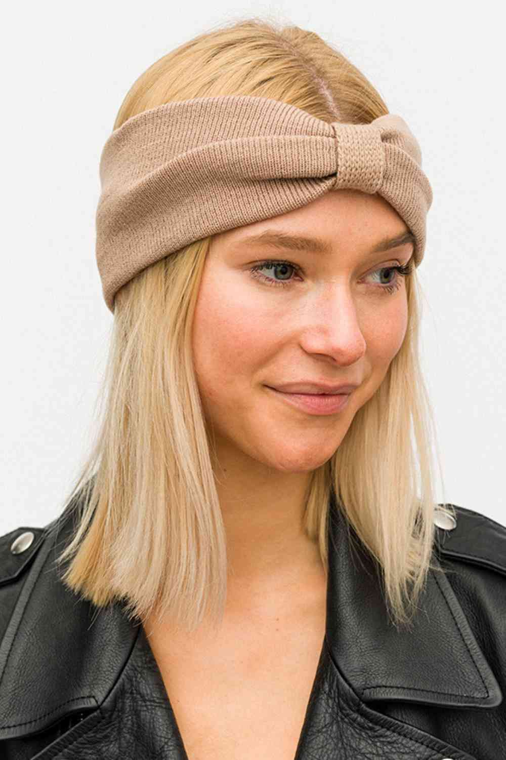 Beige Elevate your accessory game with this charming knit bow headwrap. Crafted from soft, durable 100% acrylic, it offers a cozy fit that works year-round. The generous 4.5" x 9" dimensions provide comfortable coverage while the classic bow design adds instant style to any outfit. Perfect for casual days, workouts, or keeping hair in place with flair.
