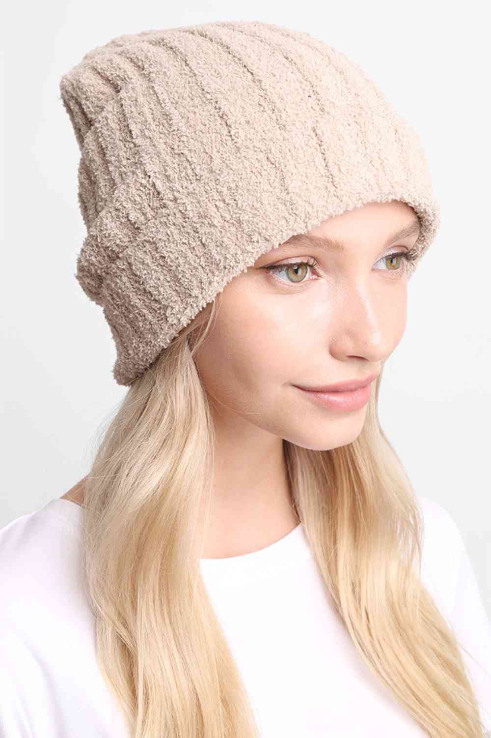 Beige Stay warm and comfortable with this Ribbed Solid Beanie, crafted from 100% poly microfiber for a soft, durable fit. The classic ribbed knit design offers timeless style that pairs effortlessly with any winter outfit.