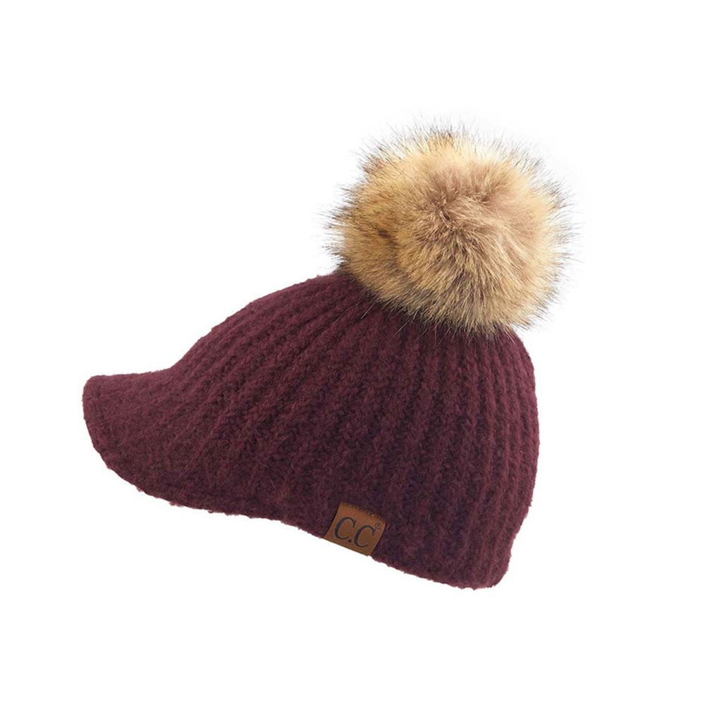 Berry Stay cozy with this knitted brim beanie featuring a plush pom pom detail. Crafted from a soft blend of 75% acrylic, 22% polyester, and 3% spandex, this winter essential delivers warmth and comfort in a versatile style. Available in nine rich colors including Beige, Berry, Dark Denim, Heather Gray, Ivory, Pistachio, Rose, Steel Blue, and Violet Purple. The ribbed knit construction and faux fur pom add texture and visual interest to any cold-weather outfit. Hand wash and lay flat to dry for lasting qual