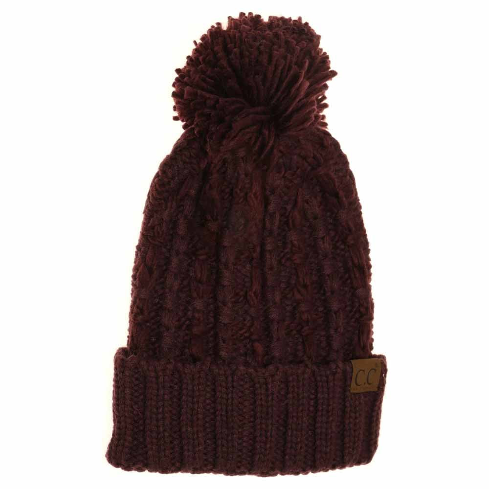 Berry Slipstitch Pom Beanie expertly blends functional warmth with refined design. Crafted with a textured slipstitch knit, it ensures durability and a snug fit while maintaining breathability. The added pom offers a subtle yet distinctive accent, making this beanie an essential piece for both outdoor protection and polished winter style. 