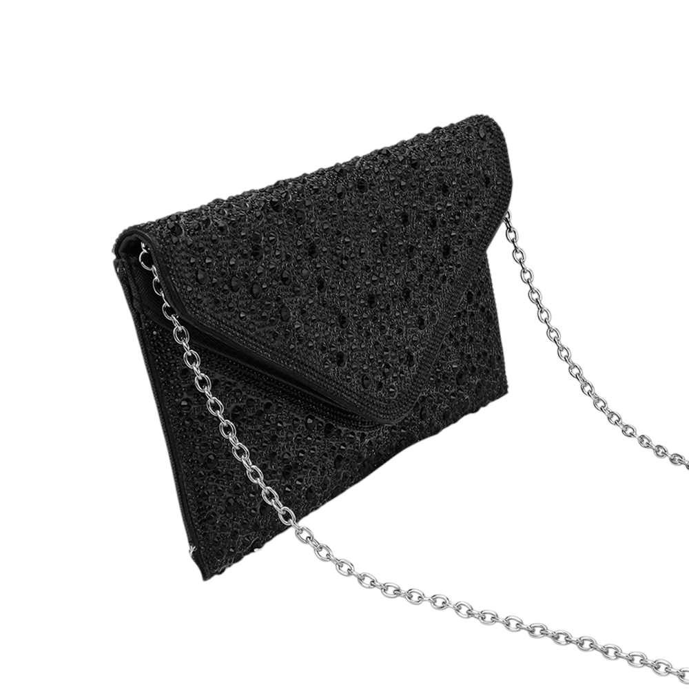 Black Bling Stone Studded Clutch Bag doubles as a crossbody bag as well, making it a versatile and stylish choice for any evening occasion. The bling stones add a touch of glamour, while the flap envelope design keeps your belongings secure. Perfect for a night out, this bag will elevate any outfit.