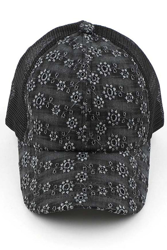 Black C.C FLOWER EMBROIDERY EYELET CRISS CROSS PONYCAP features delicate flower embroidery and eyelet detailing, with a criss cross design for a chic and stylish look. Made with quality materials, this cap offers both fashion and functionality. Perfect for any casual or outdoor activity, it will keep you cool and covered.