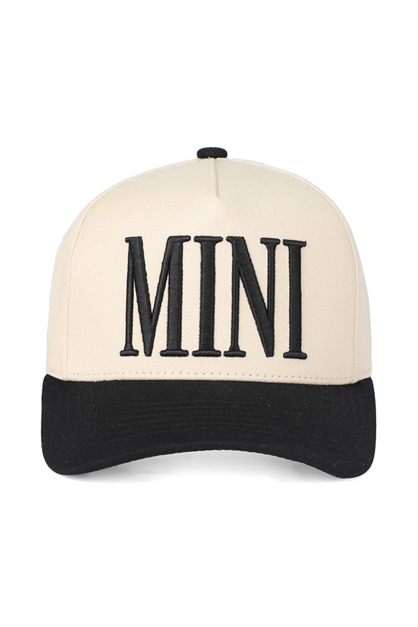 Black C.C. Mini Embroidered Kids Snapback Trucker Cap combines style and comfort tailored for children. Featuring a breathable mesh back and adjustable snap closure, it ensures a secure fit for growing heads. The detailed embroidery adds a polished look, making it a durable and fashionable accessory for everyday wear or outdoor activities. Ideal for protecting young ones from the sun while keeping them trendy. 

