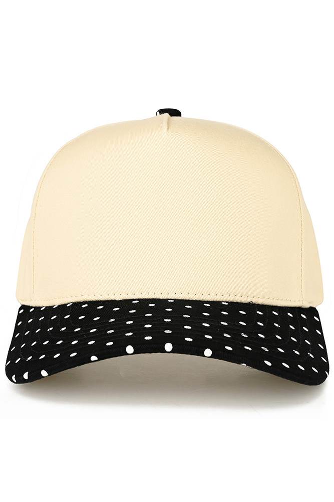 Classic style meets playful design with this C.C trucker hat. The small polka dot pattern adorns the brim, while the two-tone construction adds visual interest and versatility. Structured mesh panels provide breathability for all-day wear, making it perfect for casual outings, outdoor activities, or everyday comfort. The adjustable back ensures a secure fit for most head sizes. Whether you're heading to the beach, running errands, or just want a fun accessory, this hat delivers both style and function.