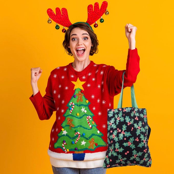 Reusable Christmas tote bag featuring a festive holly and berry print. Ideal for holiday shopping, gifting, or seasonal outings. Durable and stylish, it's a cheerful addition to your holiday essentials.