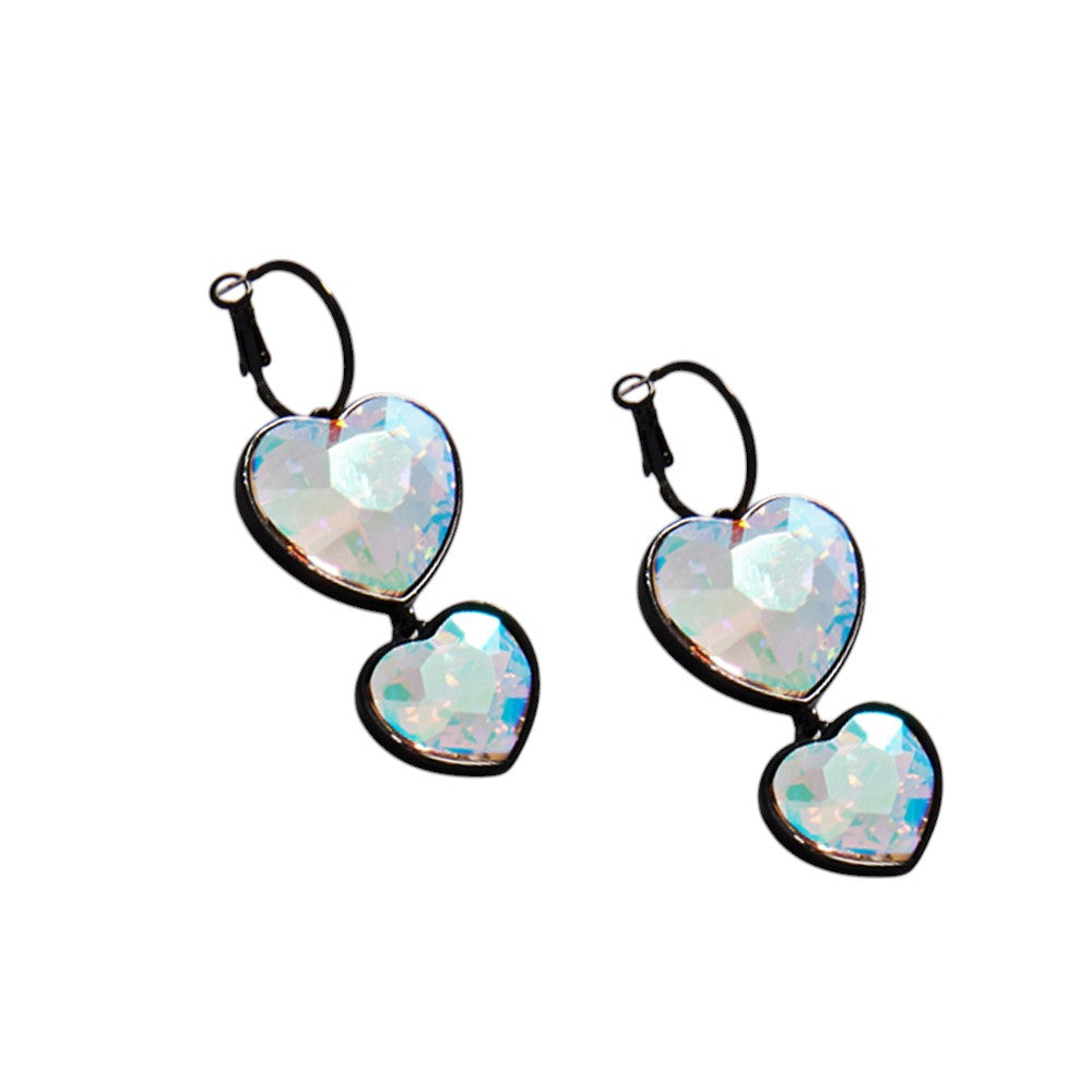 Black Crystal Stone Double Heart Link Dropdown Earrings are expertly crafted with intricate details that will add a touch of sophistication to any outfit. The sparkling crystal stones and unique heart link design make these earrings a perfect addition to any jewelry collection. Elevate your style with these stunning earrings.