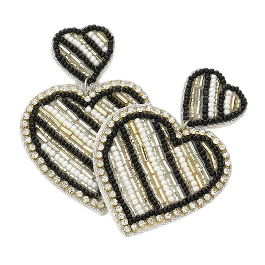 Black Felt Back Beaded Double Heart Link Dangle Earrings are a charming addition to any jewelry collection. The intricate beaded design adds elegance, while the felt backing ensures comfort throughout the day. Perfect for adding a touch of romance to any outfit. Crafted with quality materials for durability and style.