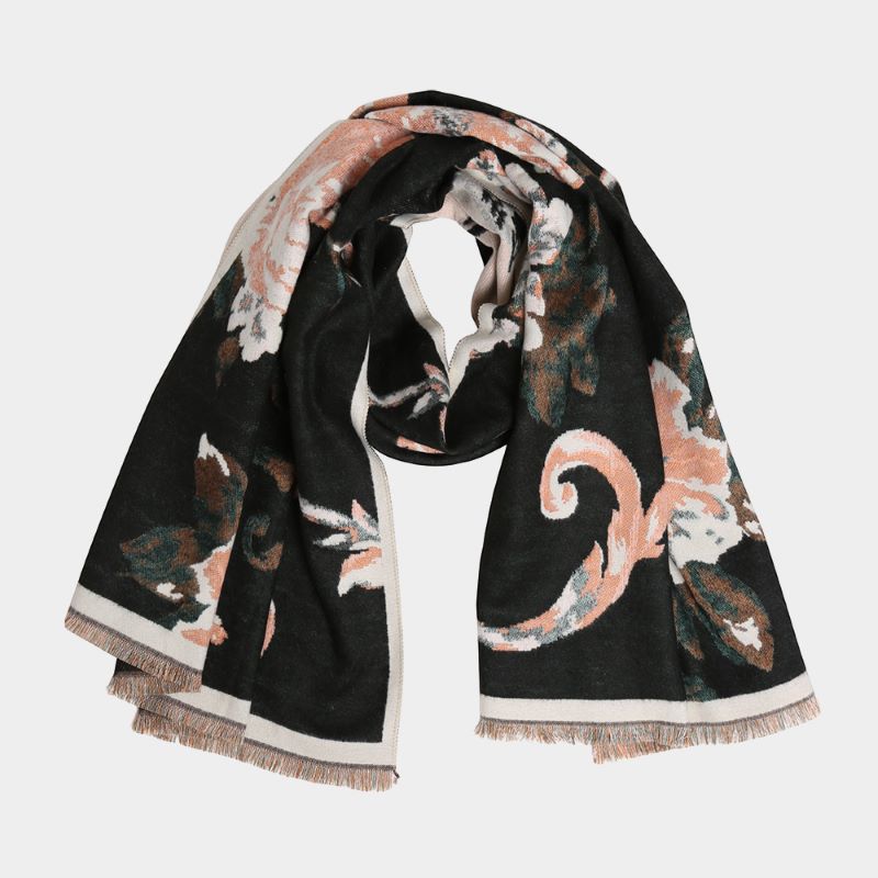 A soft scarf featuring an elegant floral print with a bordered edge and fringe finish. Lightweight yet cozy, this versatile accessory brings warmth and a touch of sophistication to casual and dressy outfits.