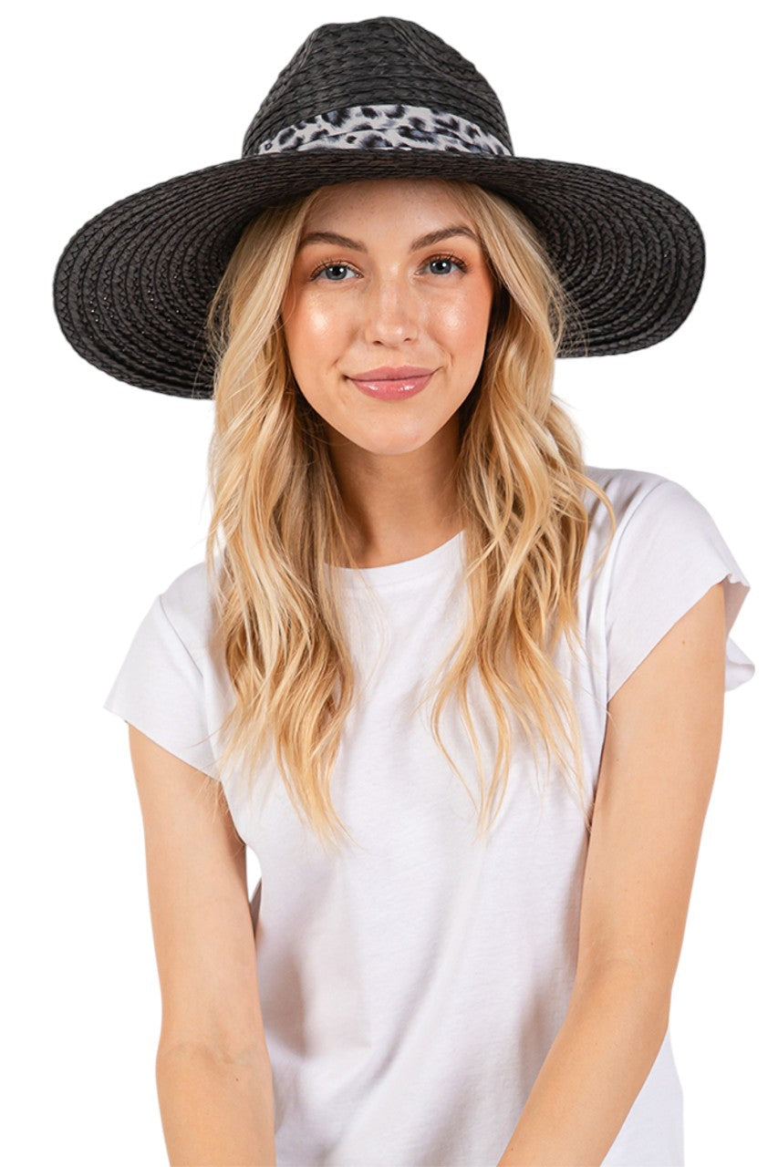 Black Leopard Trim Band Summer Straw Sun Hat features a distinctive leopard trim band that adds a touch of wild elegance to your warm-weather wardrobe. The wide brim provides optimal sun protection while maintaining a sophisticated silhouette. Lightweight and breathable construction ensures comfort during extended outdoor wear.