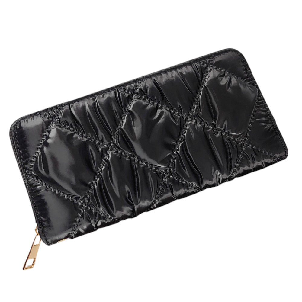 Black Shiny Faux Leather Padded Wallet with Wristlet offers a sleek and stylish solution for storing your essentials. Its shiny faux leather material adds a touch of sophistication, while the padded design keeps your valuables safe. The attached wristlet also provides convenience and hands-free carrying. 